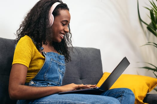 Young black woman working with laptop photo