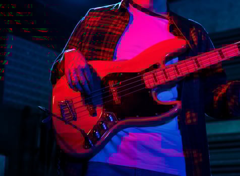 Young Musician Playing The Bass In A Live Concert photo