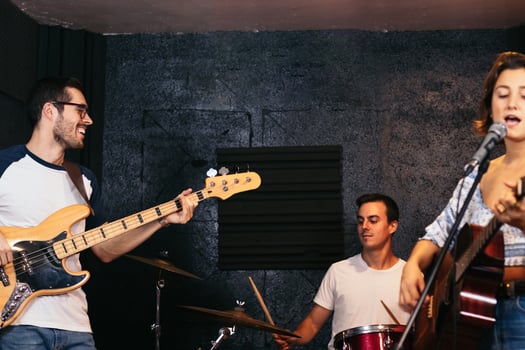 Music group rehearsing in a music venue. Singing photo