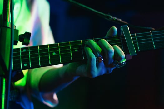 Musicians In Stage With Colorful Lights Performing In A Live Concert photo