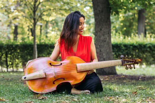Woman with cello in a park photo