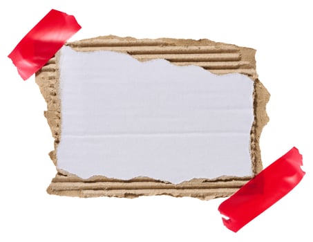 Torn piece of white corrugated cardboard attached to red piece of electrical tape, isolated background. Copy space photo