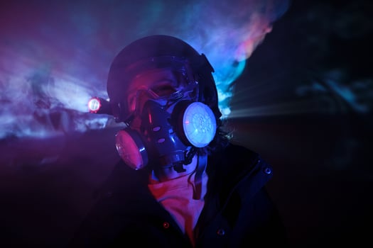 Boy robbing dark mint with smoke photo