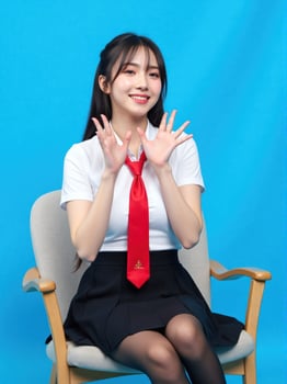 A woman wearing a white shirt and black skirt photo