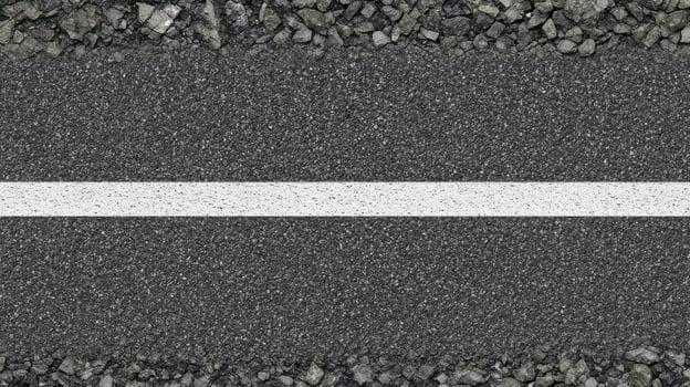 Asphalt road with white line and gravel edges captures urban infrastructure concept photo