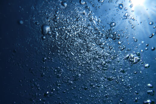 Bubbles in deep sea water photo