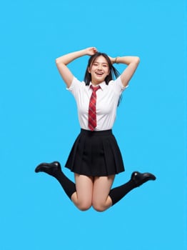 A young woman in a school uniform jumping in the air photo