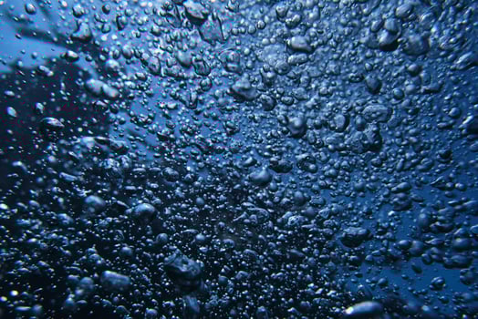 Background with air bubbles in water photo