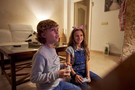 Children playing games at home photo