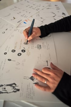 Designer drawing sketch on paper at workplace photo