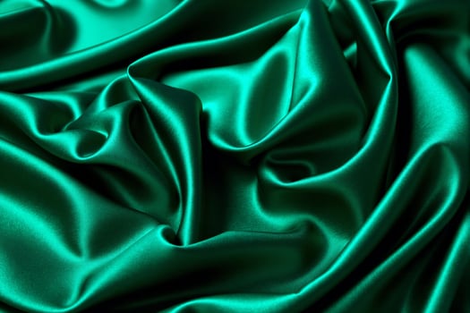 A close up of a green satin fabric photo