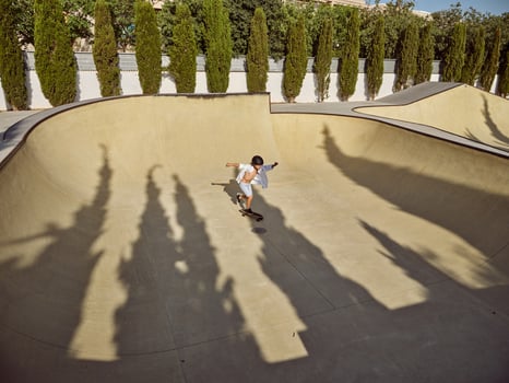 A skateboarder riding a ramp at a skate park. photo
