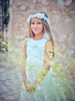 Charming girl in flower wreath photo