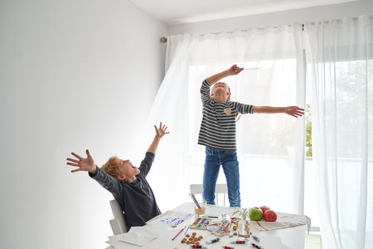 Excited siblings having fun at home photo