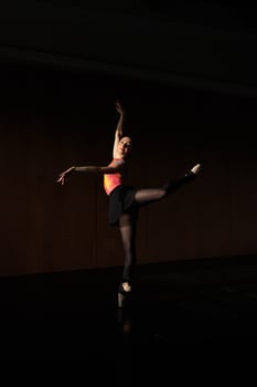 A woman in a black tights and a pink top photo