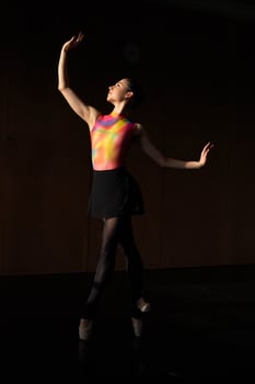 A woman in a black skirt and a pink top photo