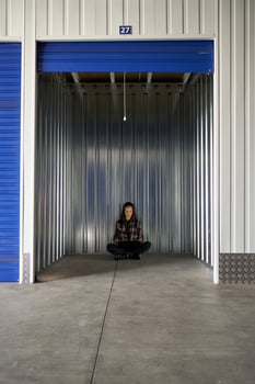 Woman sitting in self storage photo