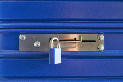 A blue storage locker with a padlock photo