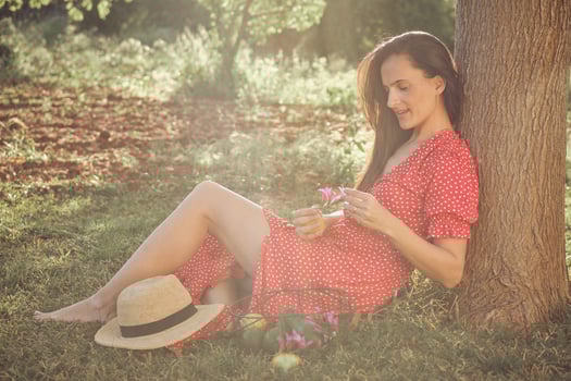 Adult woman in park on sunny day photo