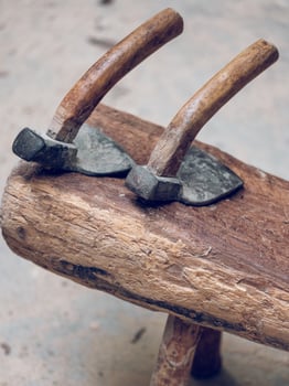Adze tools on wooden surface photo
