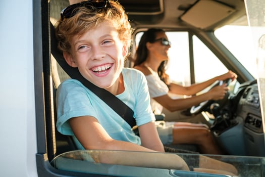 Kid with mother having summer trip by car photo