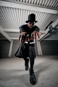 Extravagant African American man dancing in garage photo