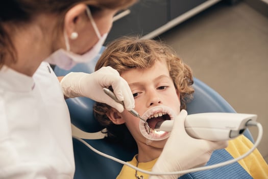 Crop dentist using intraoral scanner for dental teeth moldings photo