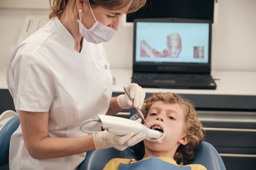 Crop dentist using dental scanner for digital displaying casts photo