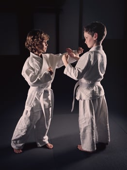 Boys practicing Krav Maga during training in studio photo
