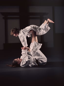 Krav Maga trainer holding boy on feet photo