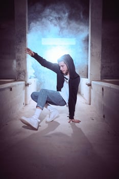 Young man preparing performing candle movement of breakdance photo