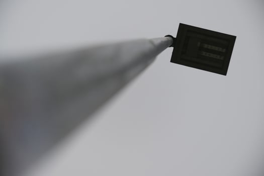 Low-Angle View of a Streetlight Against Gray Sky photo