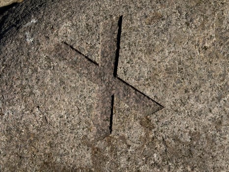 Carved Stone Cross Symbol X photo
