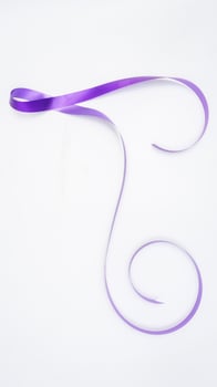 Purple ribbon isolated on white background photo