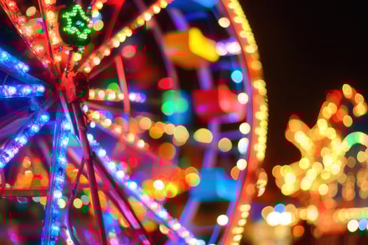 Colorful illuminated ferris wheel at a night fair. photo