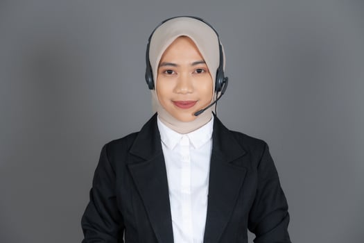 Young Girl Customer Service Representative Agent in a Hijab Smiling photo