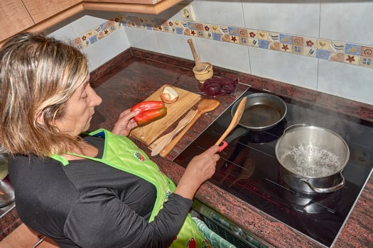 A grandmother s touch preparing fresh dishes in a contemporary kitchen photo