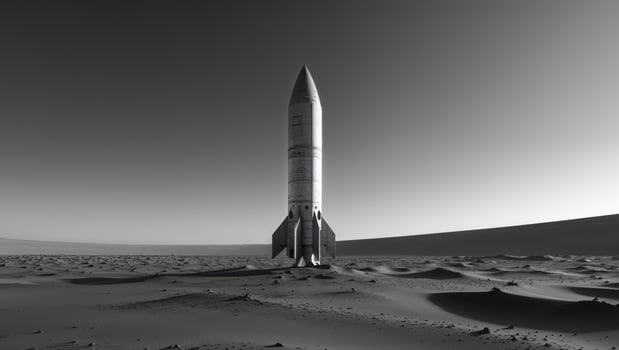 A black and white image of a rocket in the desert photo