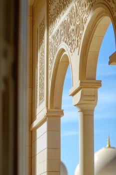 A view of a building with arches and pillars photo