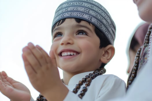 A young boy wearing a headdress and a prayer beads photo
