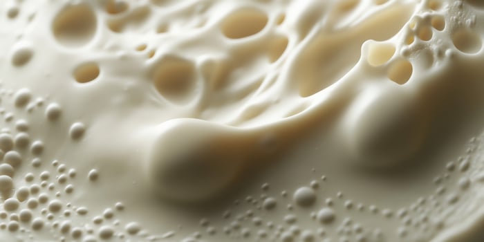 Soft cheese texture close-up with creamy, smooth appearance photo