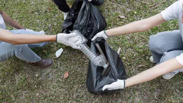 Community volunteers participating in a cleanup drive, collecting plastic waste. photo