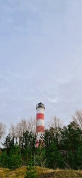 Vertical photography with lighthouse on background photo