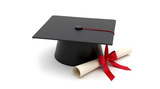 A graduation hat and diploma on a white background photo
