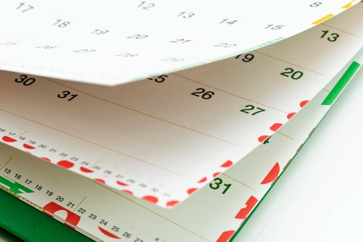 Closeup view of calendar pages showing days and dates for planning activities and events photo