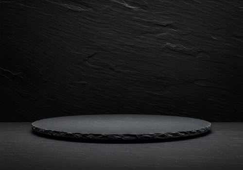 Dark Slate Platform Against Textured Stone Wall photo