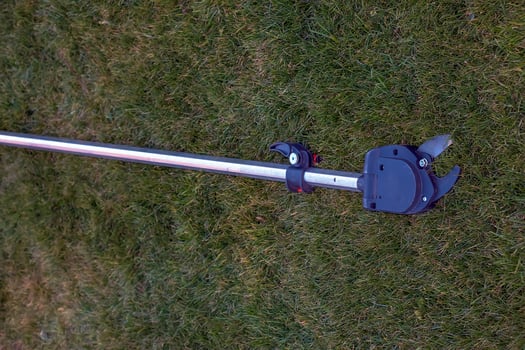Garden pruner for high-altitude work. Close-up photo