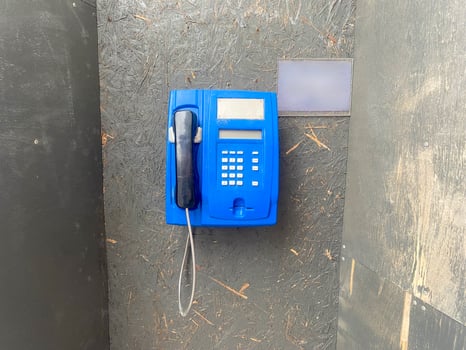 Phone booth for talking on the phone in the street, phone on the wire photo
