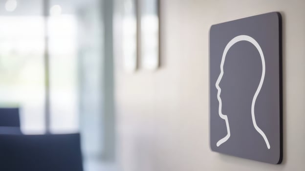 Sign indicating an area for quiet reflection in a modern building located in an urban environment, featuring a minimalist design with a human profile outline photo
