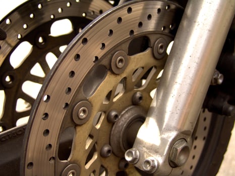 Detailed Close up of Motorcycle Brake Disc and Caliper photo